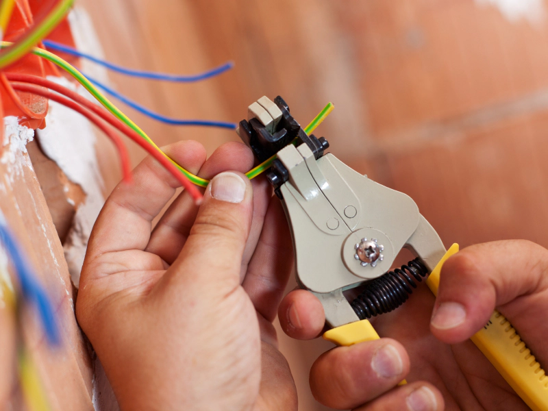electrician cutting cables during an installation pearland tx